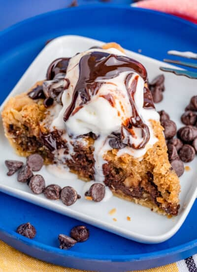 A photo of chocolate chip cookie pie on a blue plate.