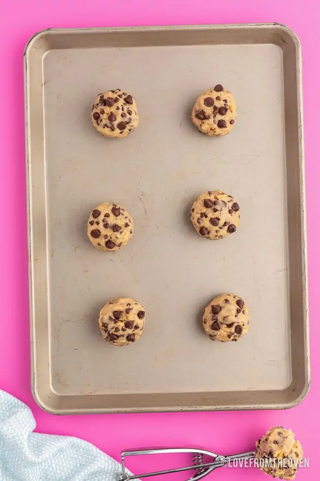 balls of levain cookie dough on a baking sheet