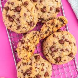 photos of levain chocolate chip cookies on a pink background