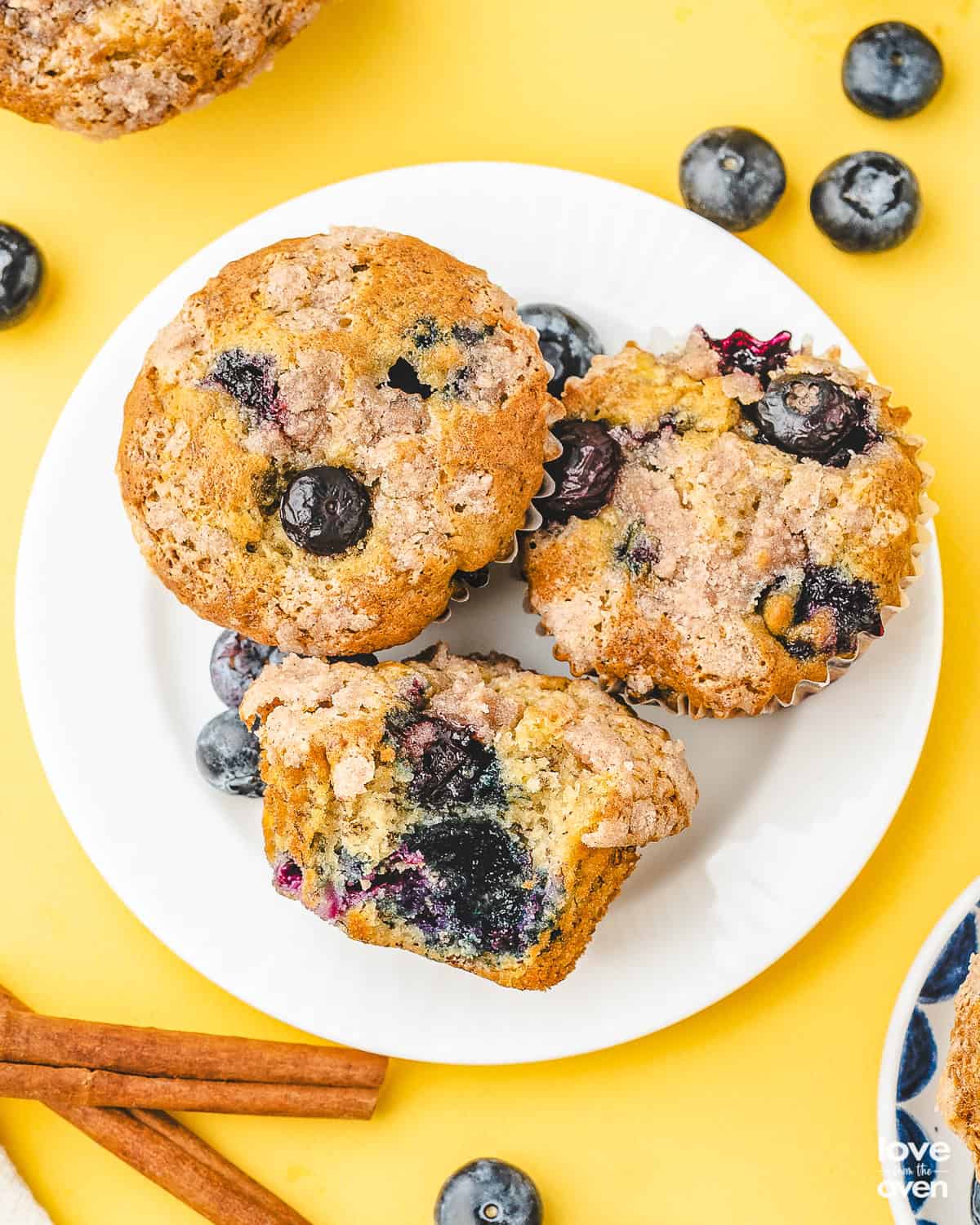 Blueberry banana muffins on a white plate.
