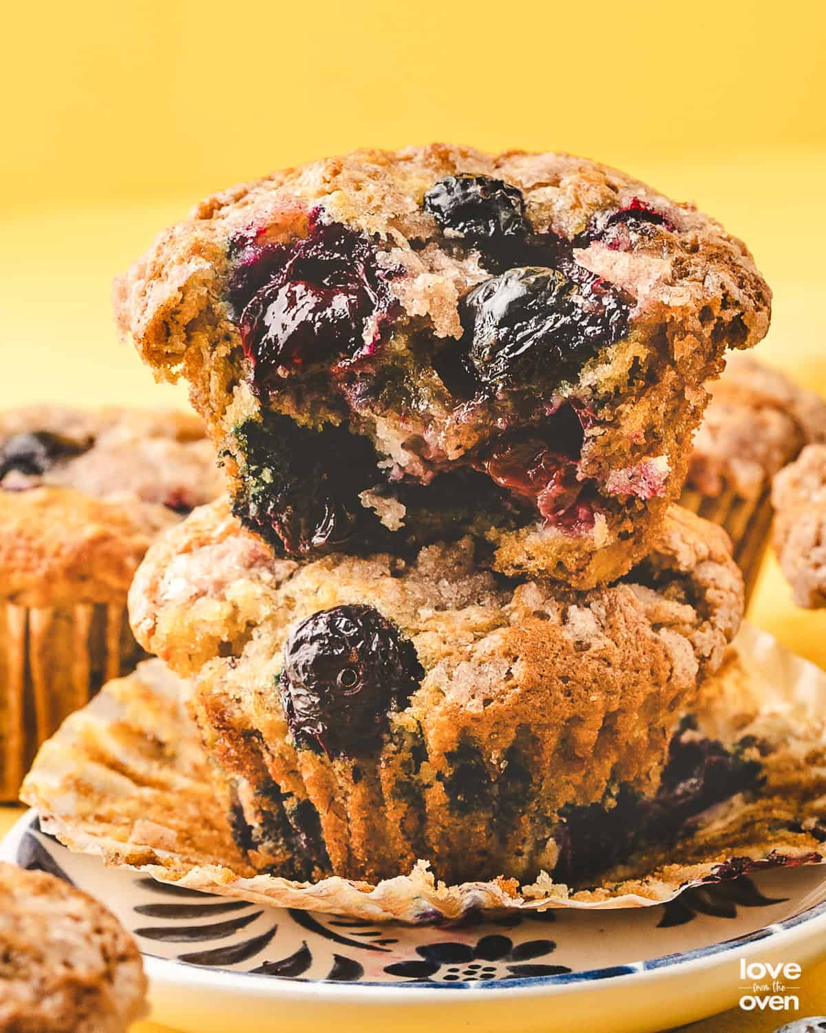 Two blueberry banana muffins stacked on each other. 