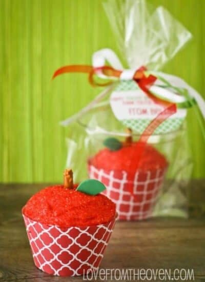 two cupcakes decorated to look like an apple