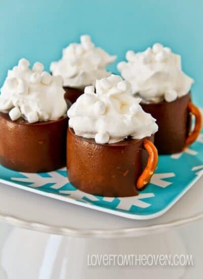 Hot chocolate pudding mugs on a blue plate.