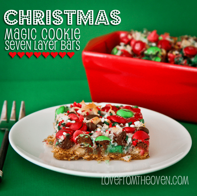 a slice of Christmas magic cookie bar on a white plate with a fork