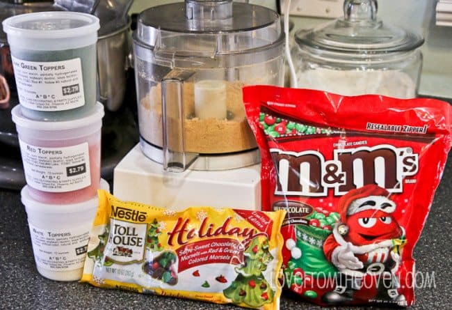 ingredients- red, white, and green sprinkles, holiday baking chocolate chips, coconut, graham cracker crumbs, holiday candies
