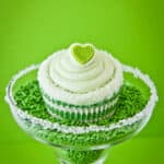 A lime cupcake in a margarita glass.