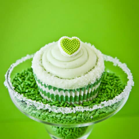 A lime cupcake in a margarita glass.