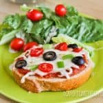 A plate of food on a table, with Pizza