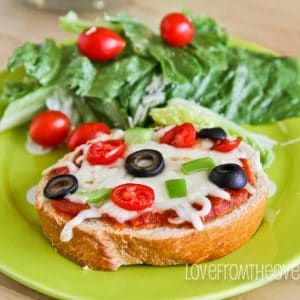 A plate of food on a table, with Pizza