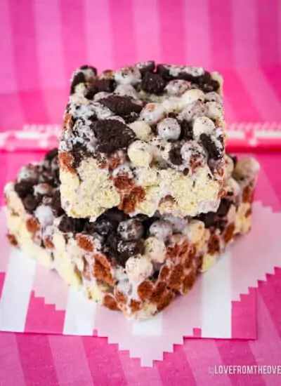 Cookies and Cream bars on a pink background.