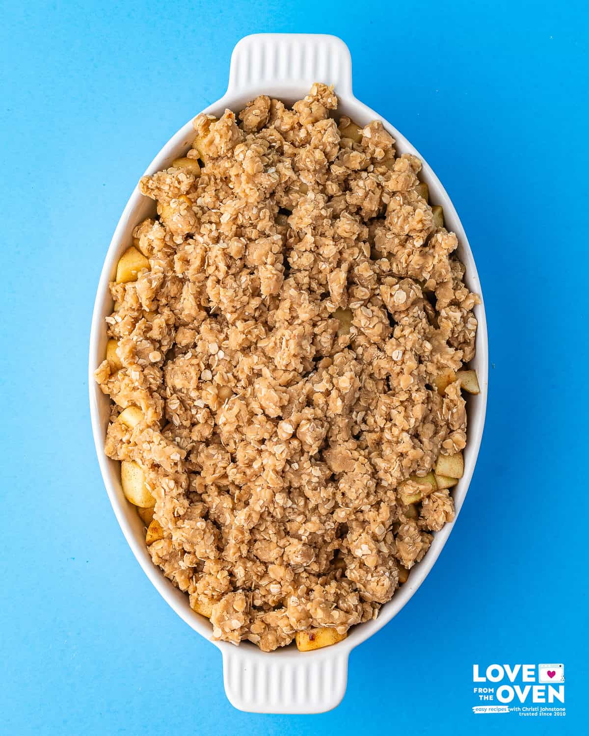 unbaked apple crumble in a baking dish