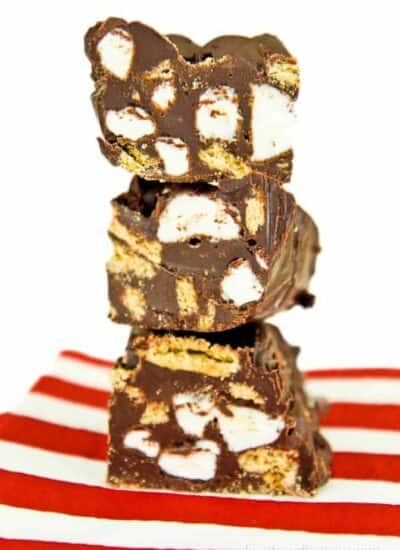 Three pieces of smores fudge stacked on top of each other.
