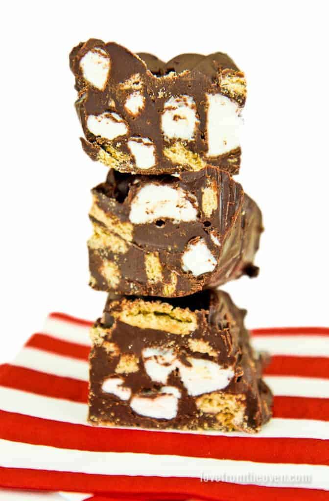 Three pieces of smores fudge stacked on top of each other.