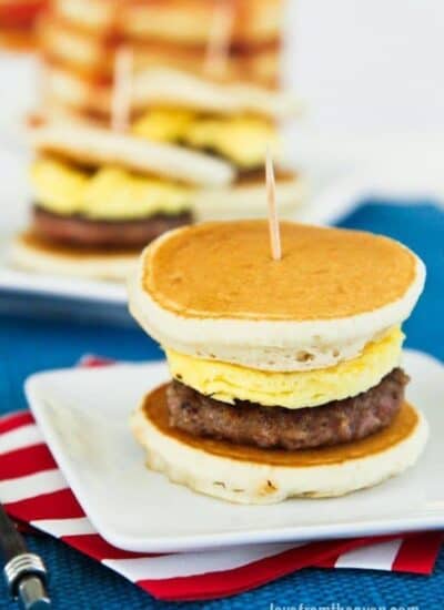 A sausage and egg slider between pancakes.