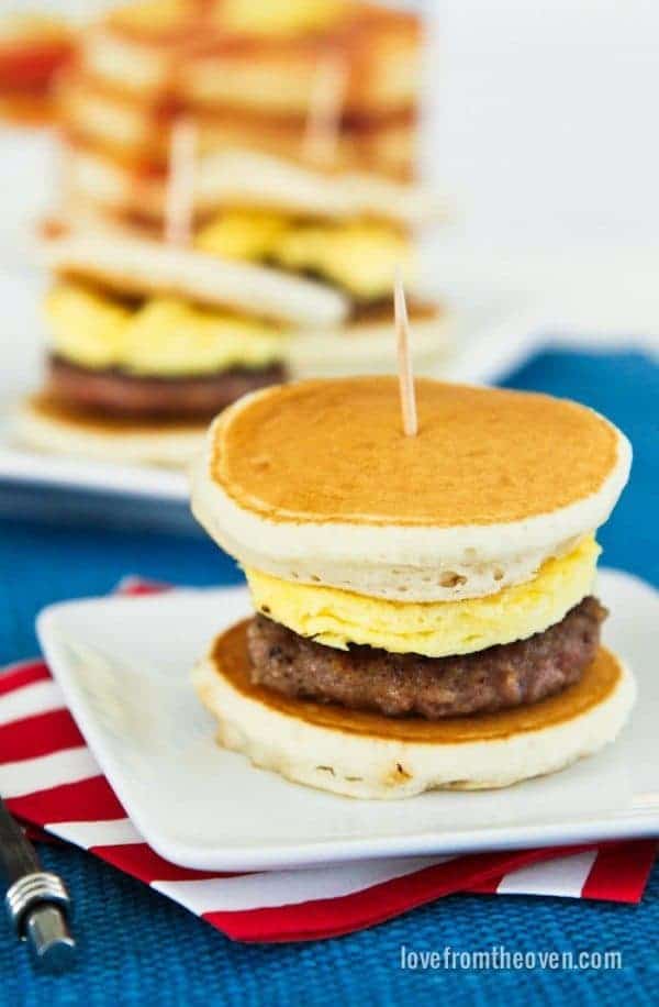 A sausage and egg slider between pancakes.