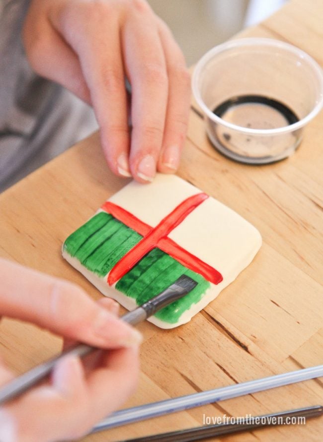 Paint cookies with a mixture of McCormick food coloring and extracts. This is so cool!