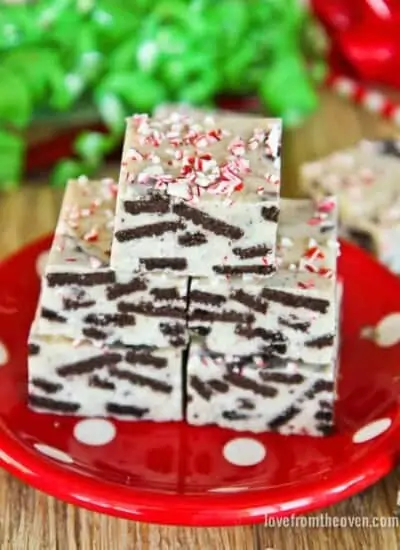 Pieces of cookies and cream fudge on a red plate