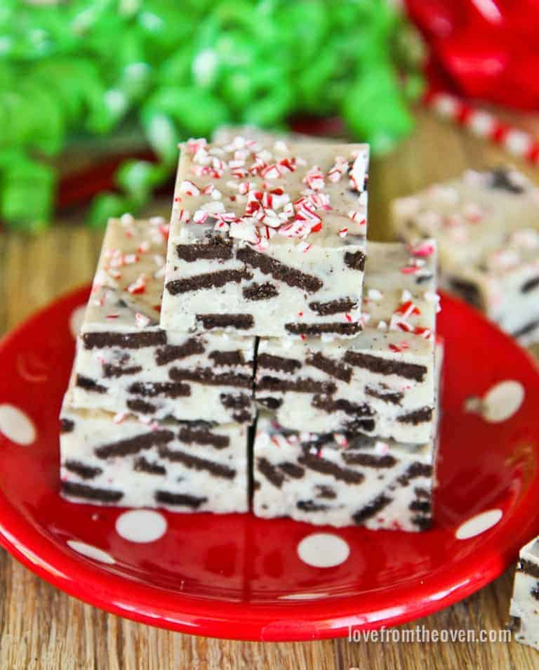 Pieces of cookies and cream fudge on a red plate