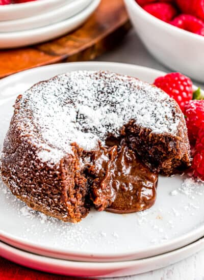 A molten chocolate lava cake with raspberries