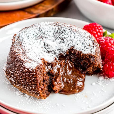 A molten chocolate lava cake with raspberries