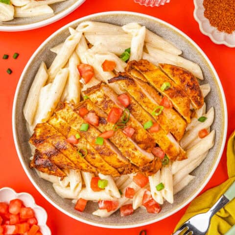 a bowl of cajun chicken pasta