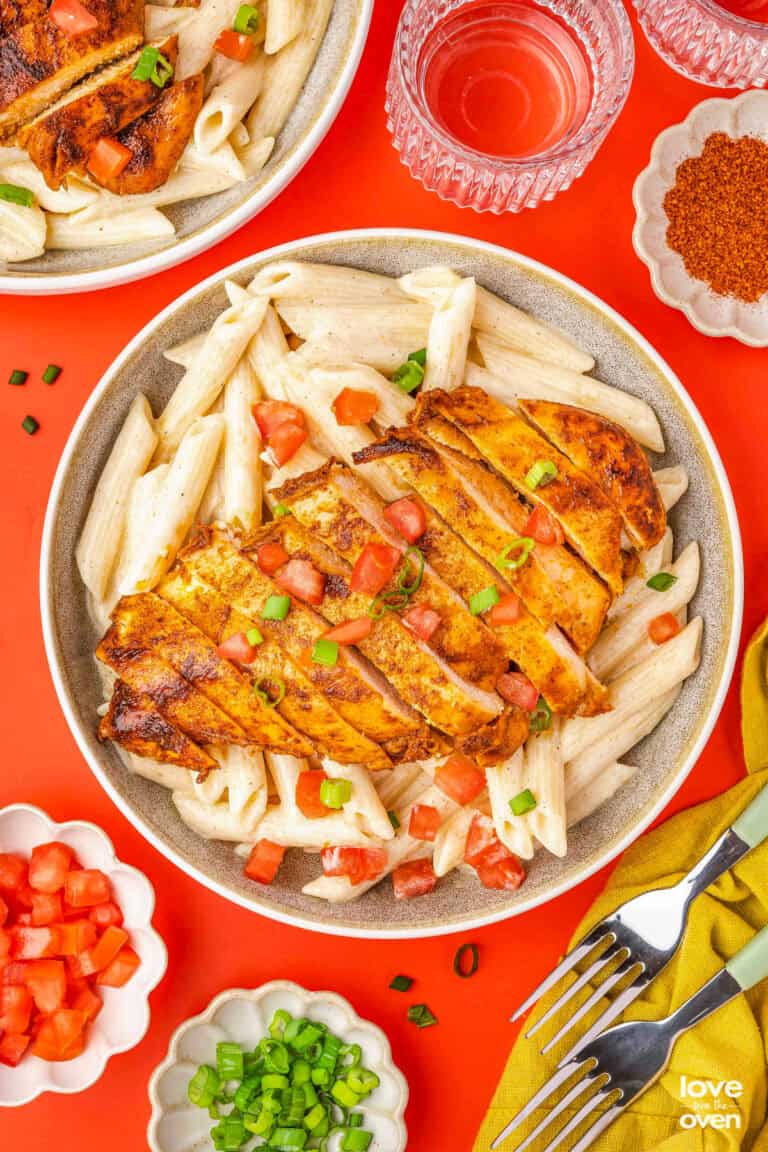 a bowl of cajun chicken pasta