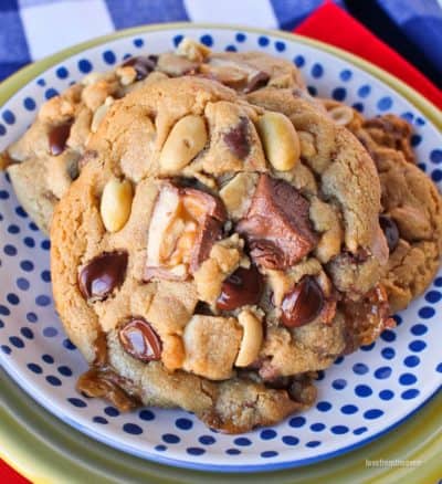 Several Snickers cookies on a white and blue plate