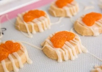 Orange slice cookies on a baking tray