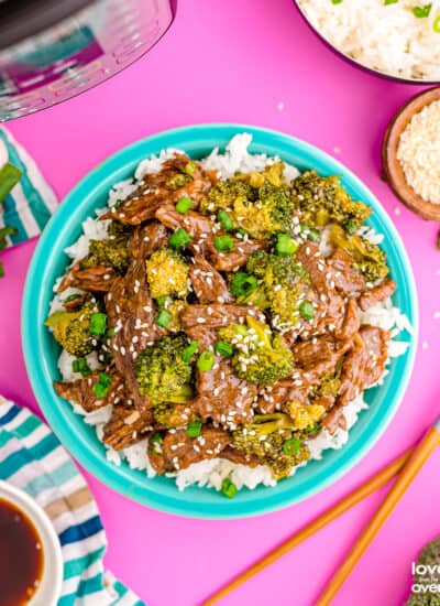 beef and broccoli on a turquoise blue plate