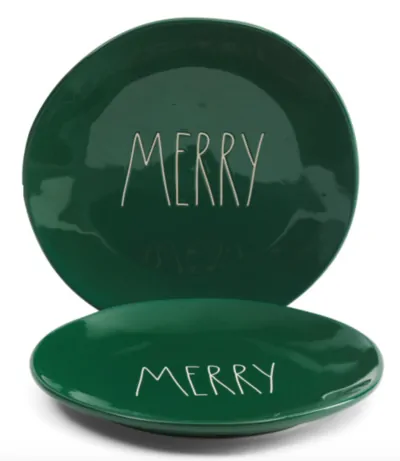 Green Rae Dunn Christmas plates that say merry in white letters