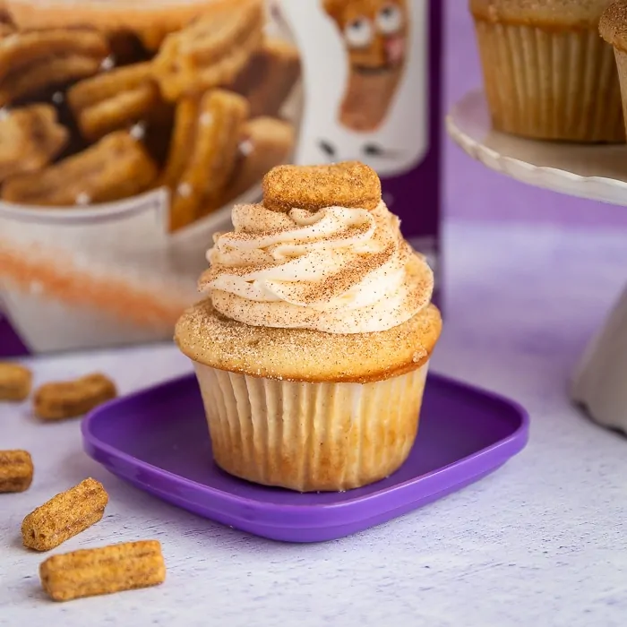 Cupcake with cinnamon and sugar topped with churro cereal