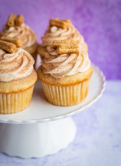 Churro cupcakes on a cake stand