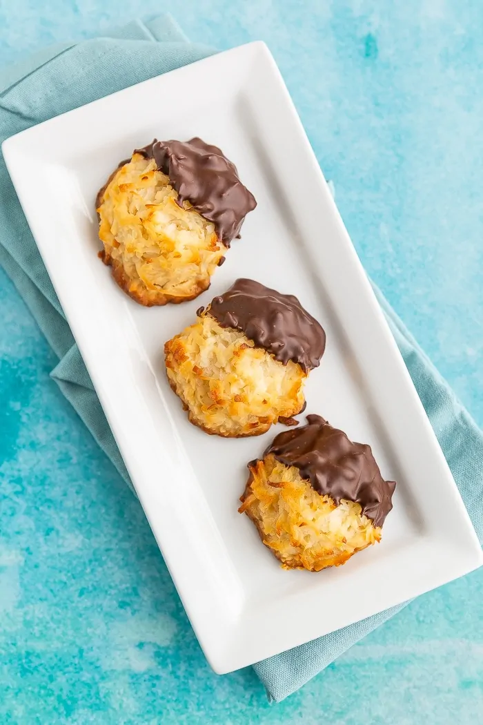 Chocolate dipped macaroons on a plate