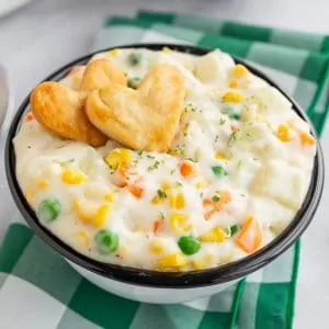 Pot pie soup in a bowl with heart shaped crackers