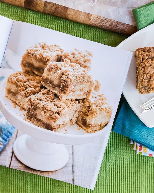 Picture from a cookbook of coffee cake next to a slice of coffee cake