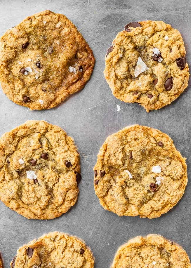 crispy chocolate chip cookies on a silver baking sheet