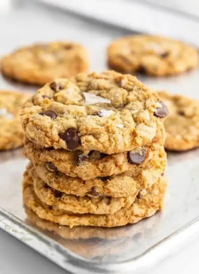stack of crispy chocolate chip cookies on a cookie sheet