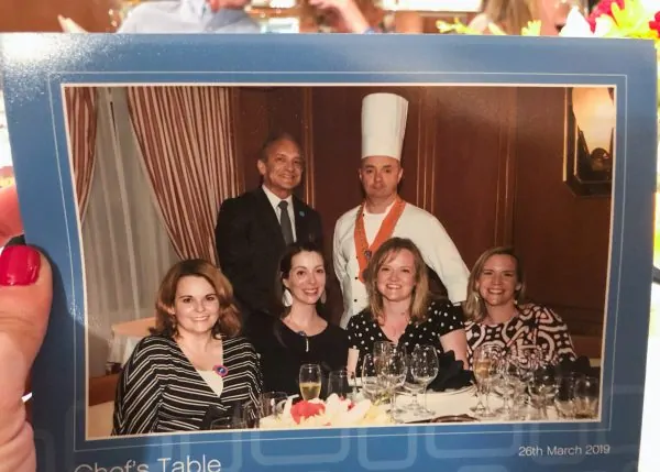 A photo of a chef and guests at a Chef's Table dinner on a Princes Cruise