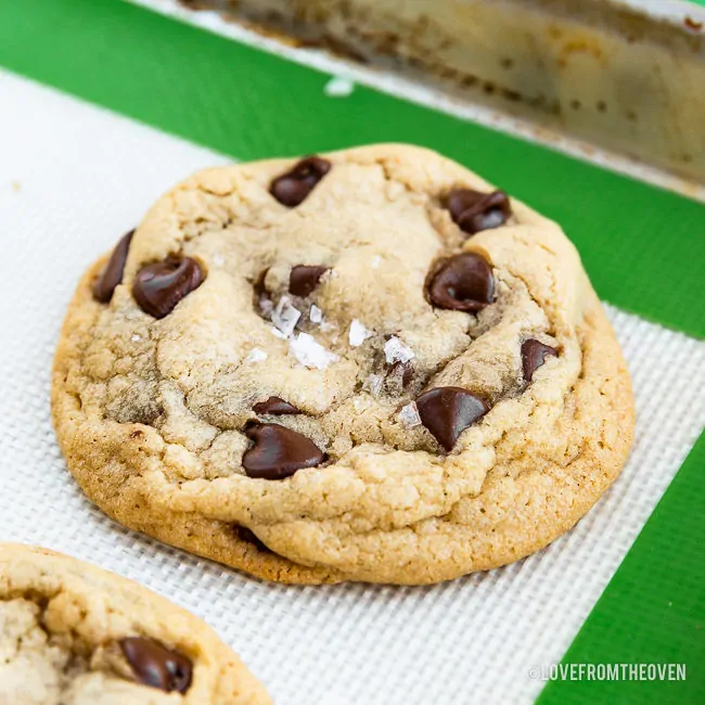 chocolate chip pudding cookie sitting on a cookie sheet