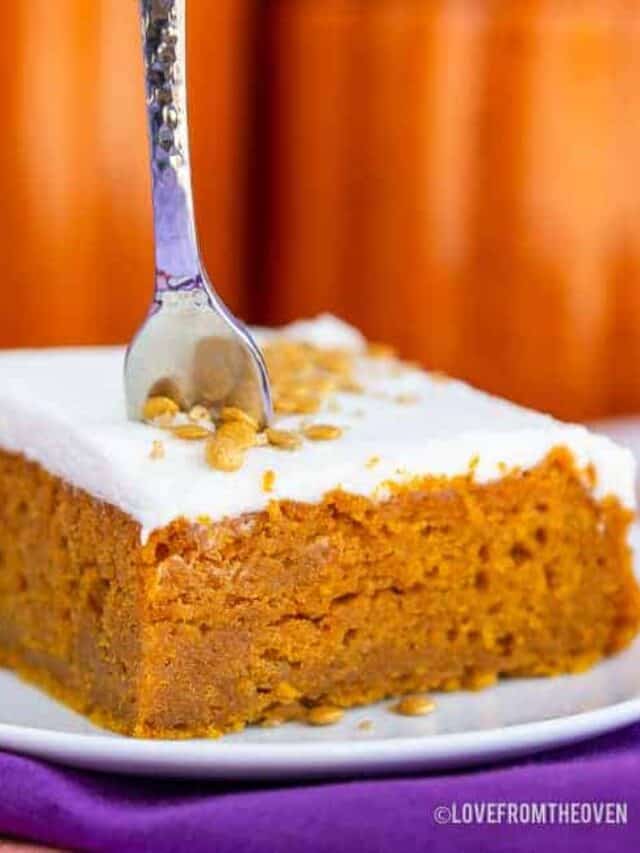 A pumpkin bar on a plate with a fork in it.