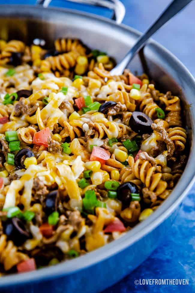 A blue bowl filled with Pasta