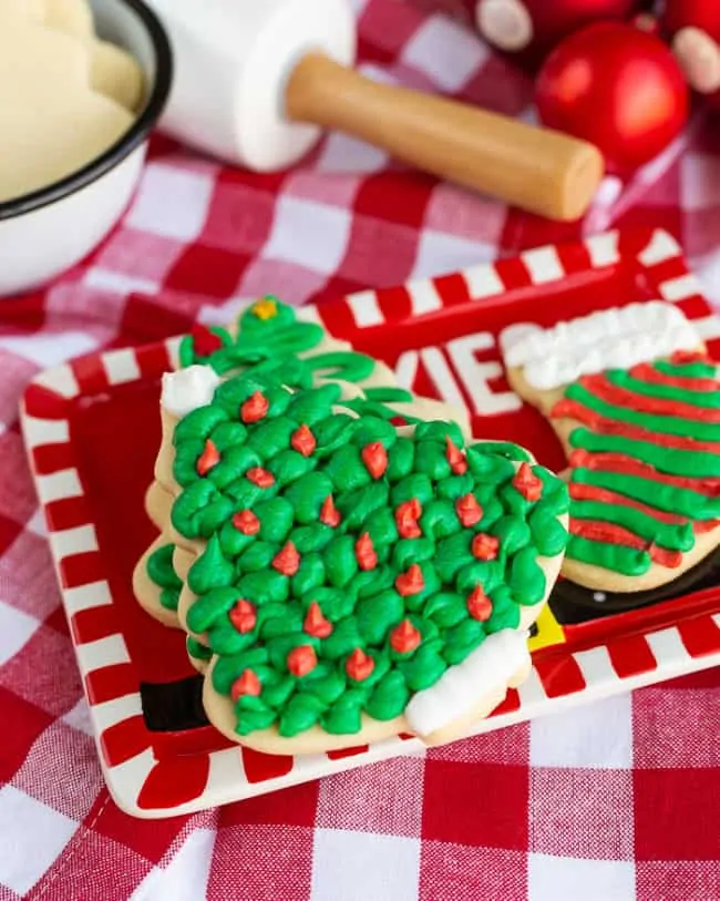 Frosted sugar cookies on a red plate