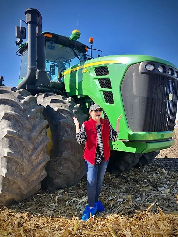 A person in front of a tractor