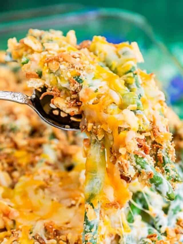 A piece of green bean casserole on a large serving fork
