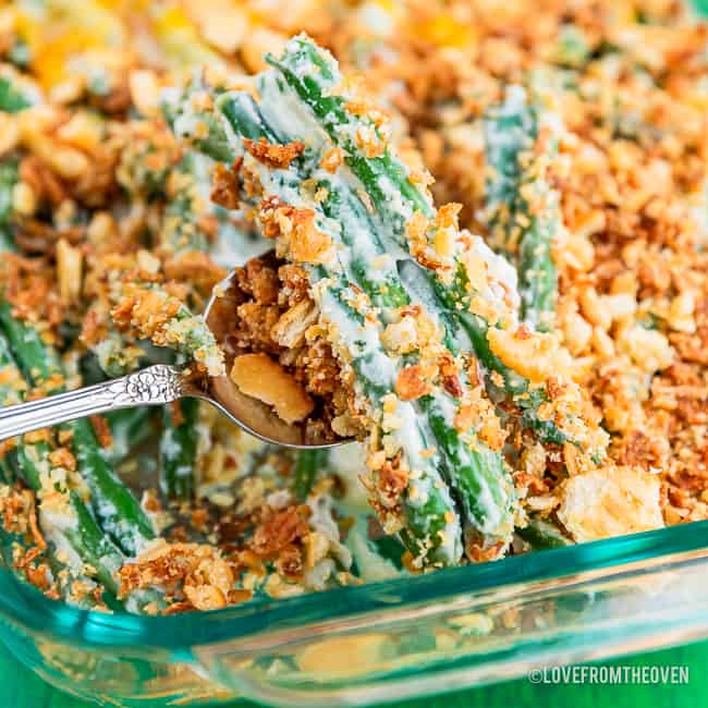 A piece of green bean casserole on a large serving fork