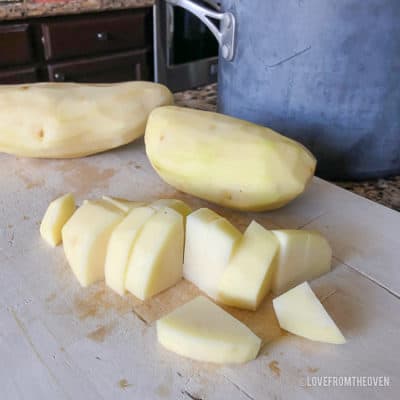 A potato on a cutting board