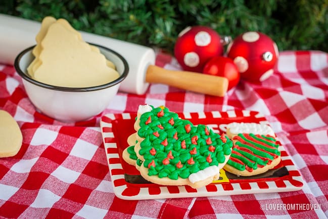 Several sugar cookies on a red plate