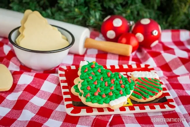 Several sugar cookies on a red plate