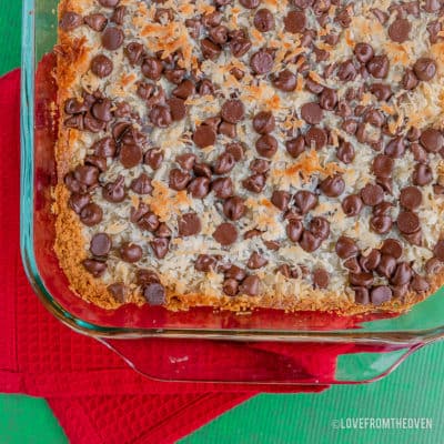 Magic cookie bars in a glass baking pan