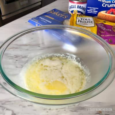 Liquid ingredients for magic cookie bars in a glass bowl